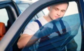 man installing window tint