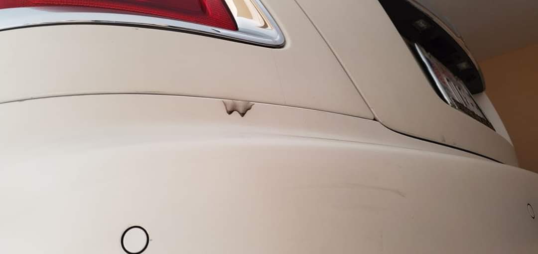 bad ppf installation on white car