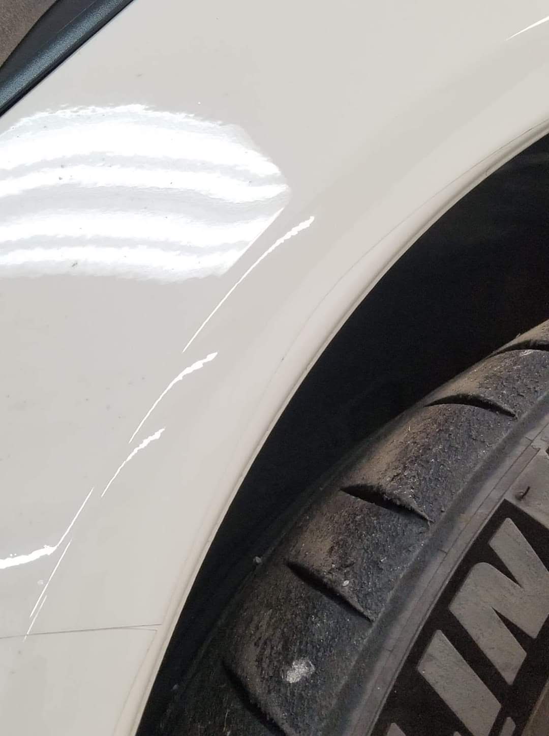 bad ppf installation on white car