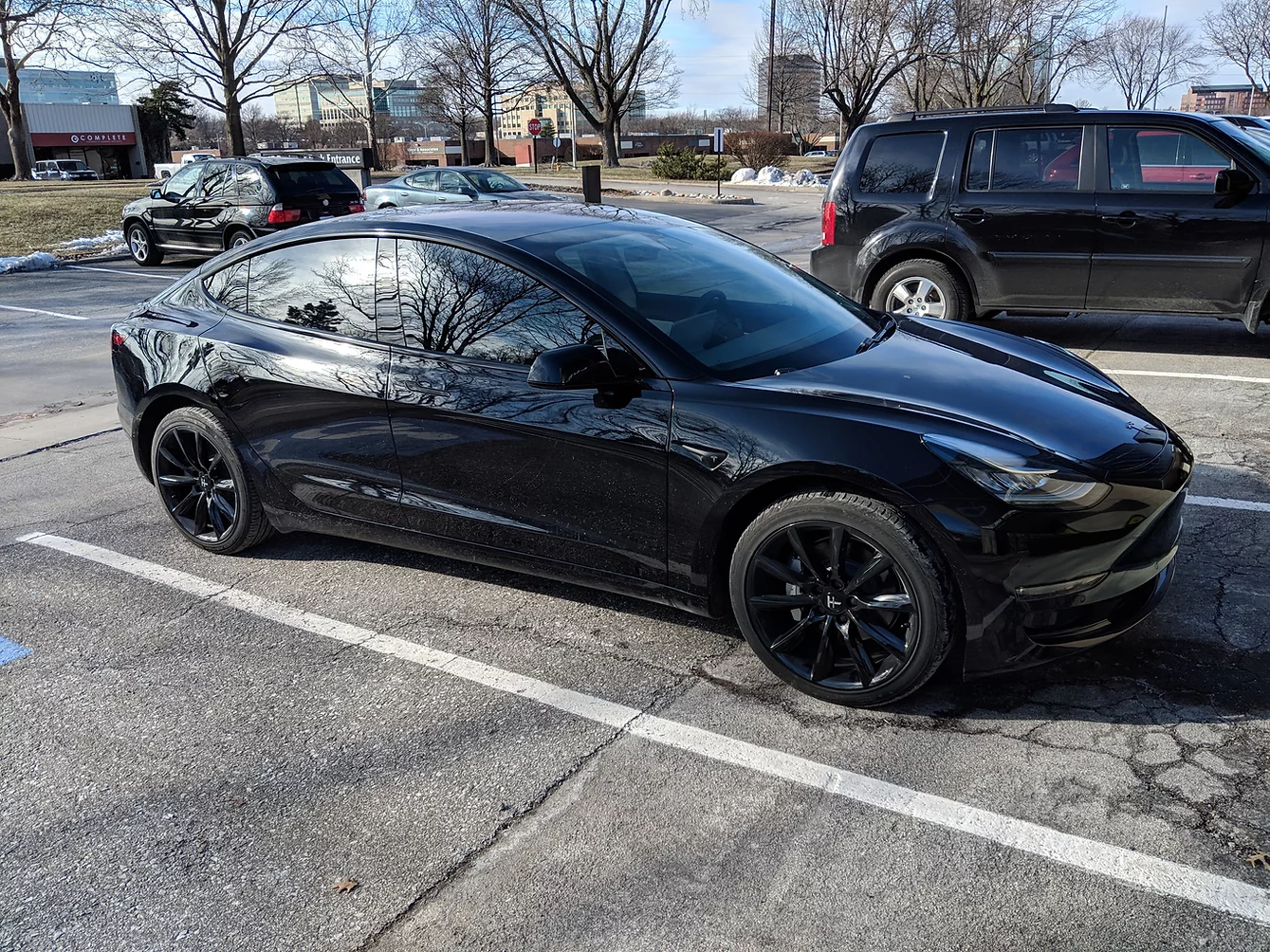 black tesla with tinted windows