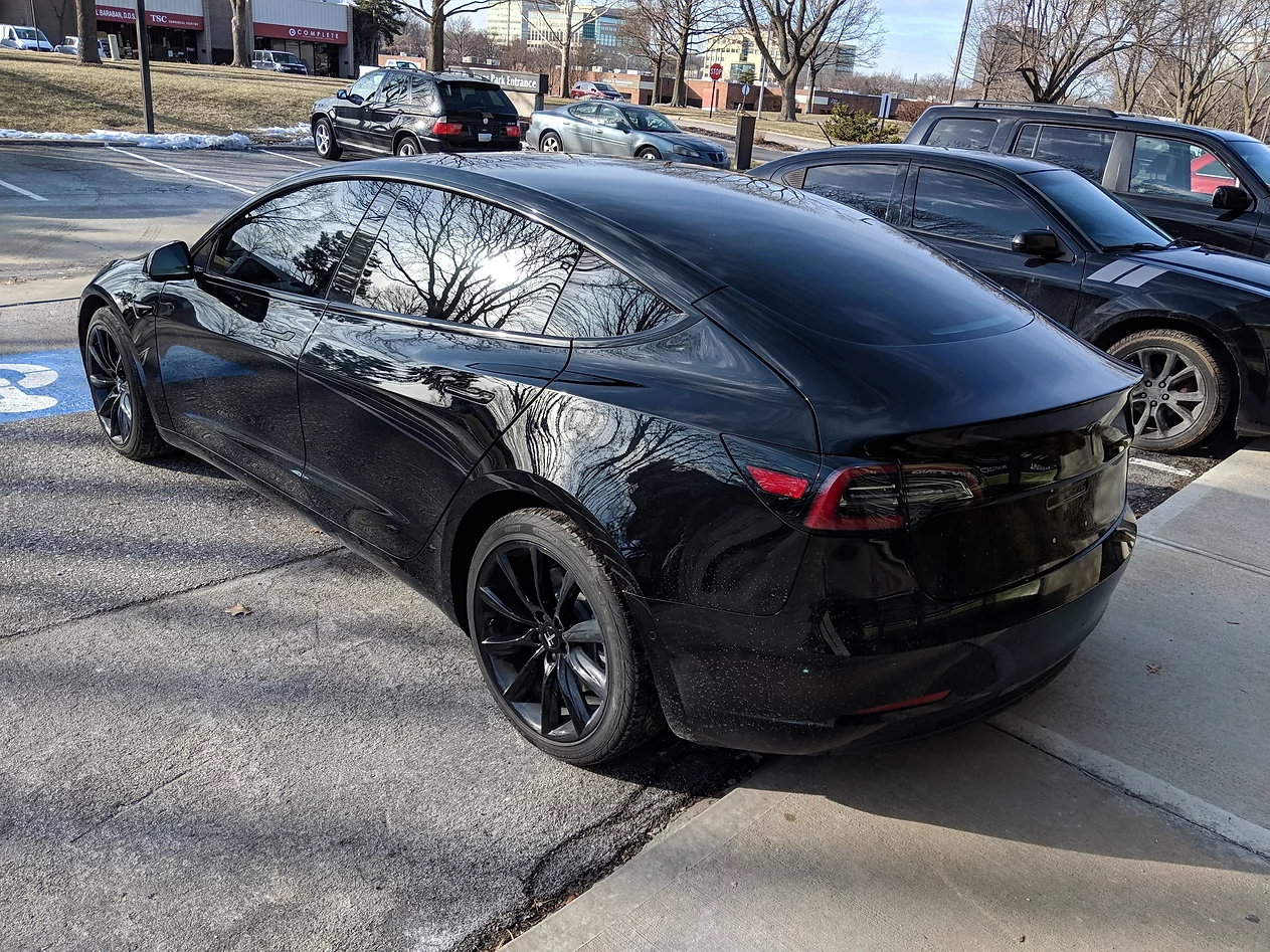 black tesla with tinted windows